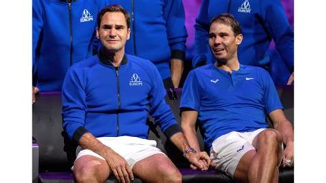 federer and nadal holding hands.